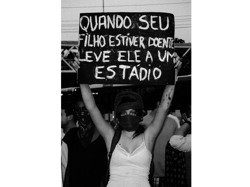 The sign says: "If your child is sick, take her/him to a stadium" The sign says: "If your child is sick, take her/him to a stadium"